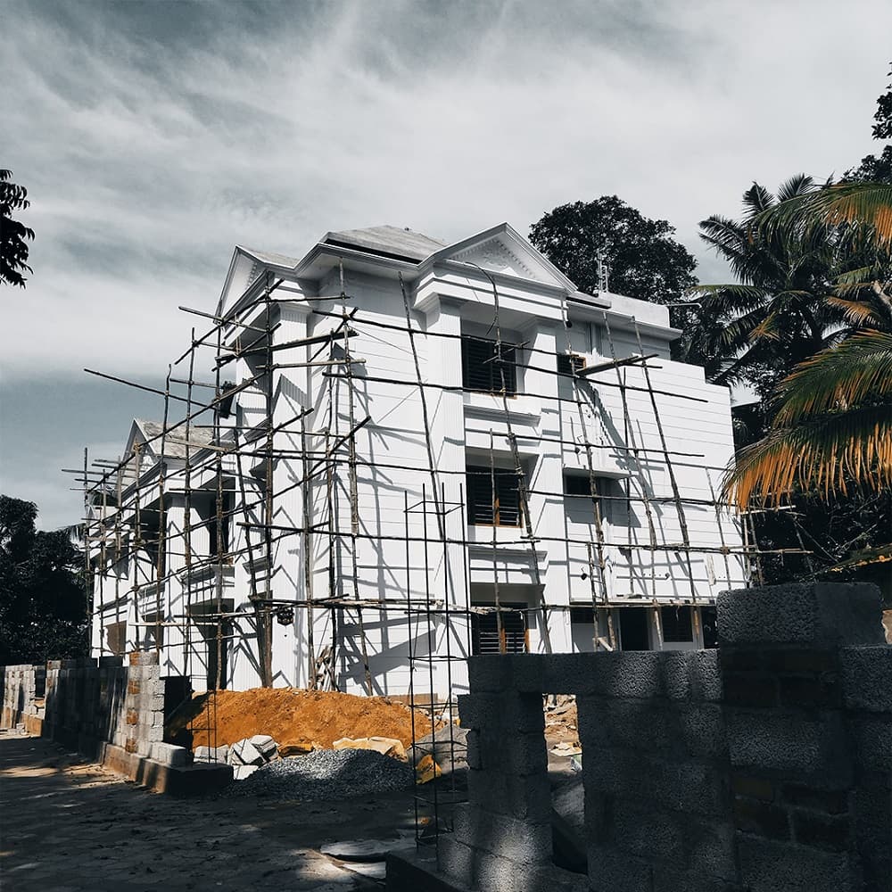 Image shows a newly completed residential villa by Kairali Constructions, a trusted residential construction company in Trivandrum